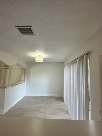 a view of a hallway view with staircase