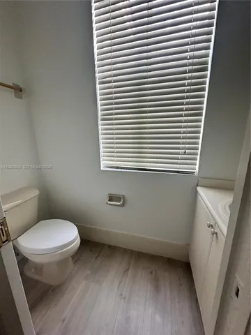 a view of a kitchen from a hallway