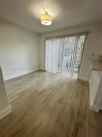a view of a kitchen with a sink and cabinets