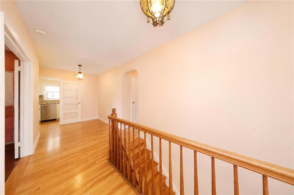 1 Bay Ridge Parkway Brooklyn, NY 11209 - Photo 7 of 38 a view of a hallway with wooden floor and a chandelier