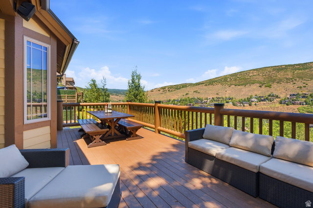 3148 Lower Saddleback Road Park City, UT 84098 - Photo 1 of 67 Expansive outdoor deck featuring composite decking, log railing, and a window with white trim