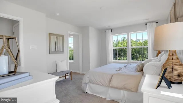 a bed room with a bed and a window