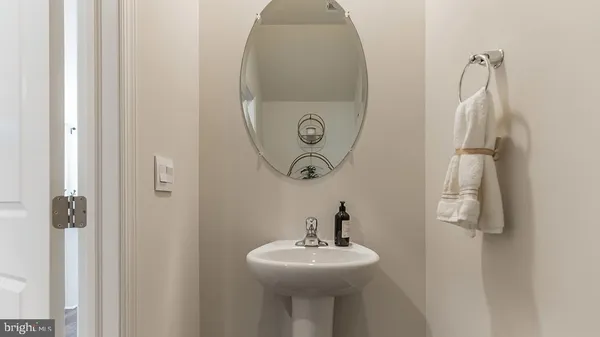a bathroom with a sink and mirror
