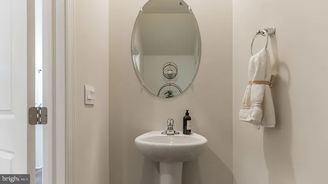 a bathroom with a sink and mirror
