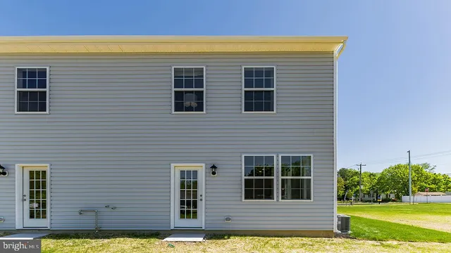 a view of front of house with a yard