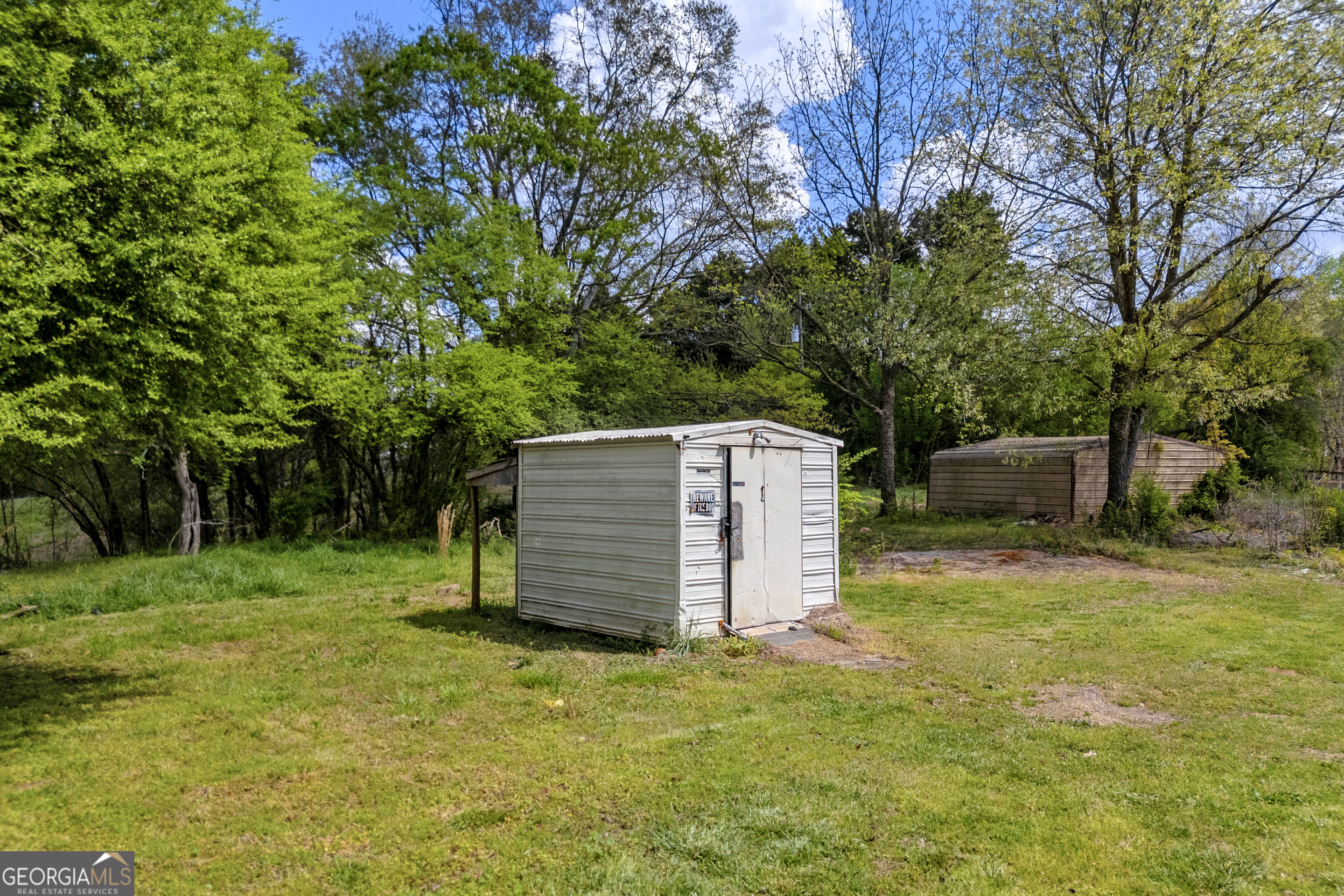 8606 Holly Springs Road Maysville, GA 30558 - Photo 21 of 74 a backyard of a house