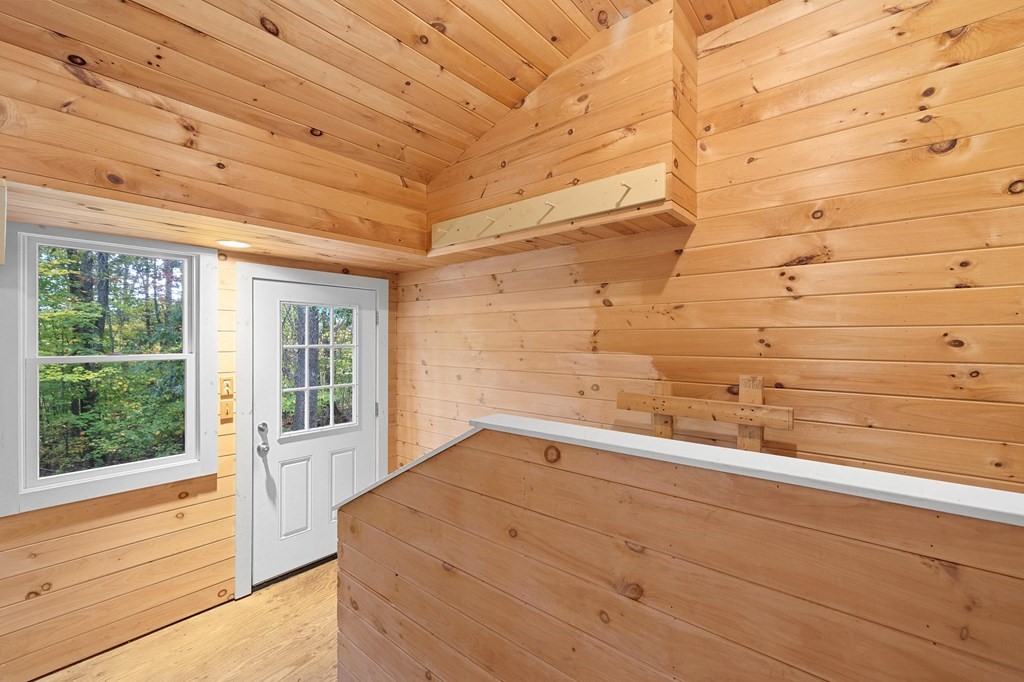 756 Bemis Road Warren, MA 01585 - Photo 15 of 41 a view of a room with an empty space and wooden floor