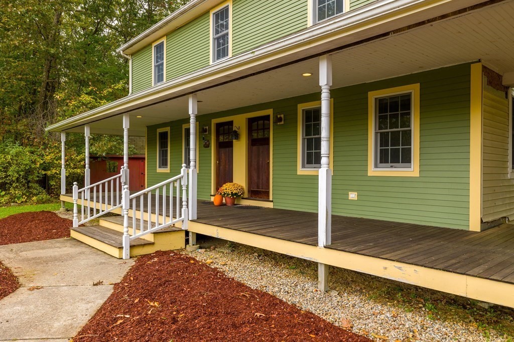756 Bemis Road Warren, MA 01585 - Photo 2 of 41 a view of a house with a small yard and wooden fence