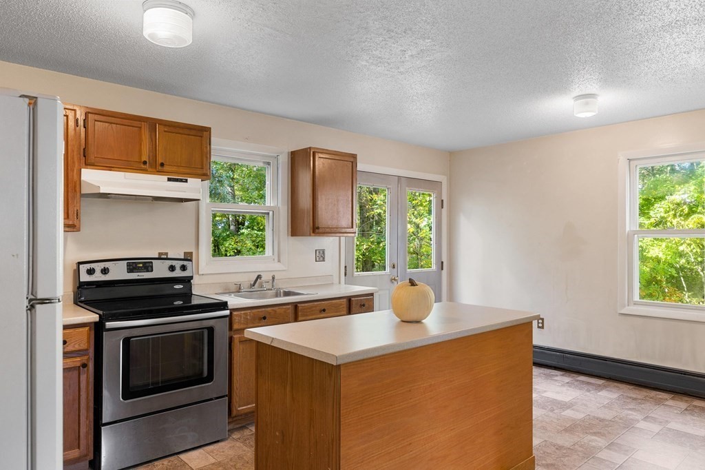 756 Bemis Road Warren, MA 01585 - Photo 28 of 41 a kitchen that has a sink and a stove