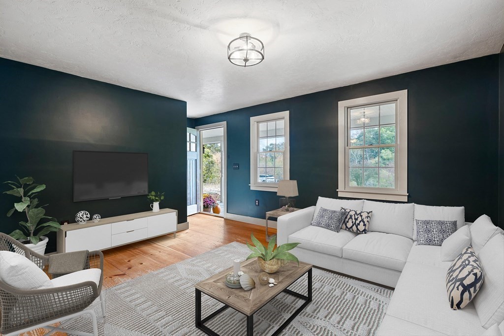 756 Bemis Road Warren, MA 01585 - Photo 3 of 41 a living room with furniture and a flat screen tv