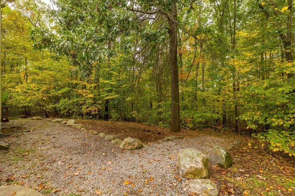 756 Bemis Road Warren, MA 01585 - Photo 40 of 41 a view of a yard with trees in the background