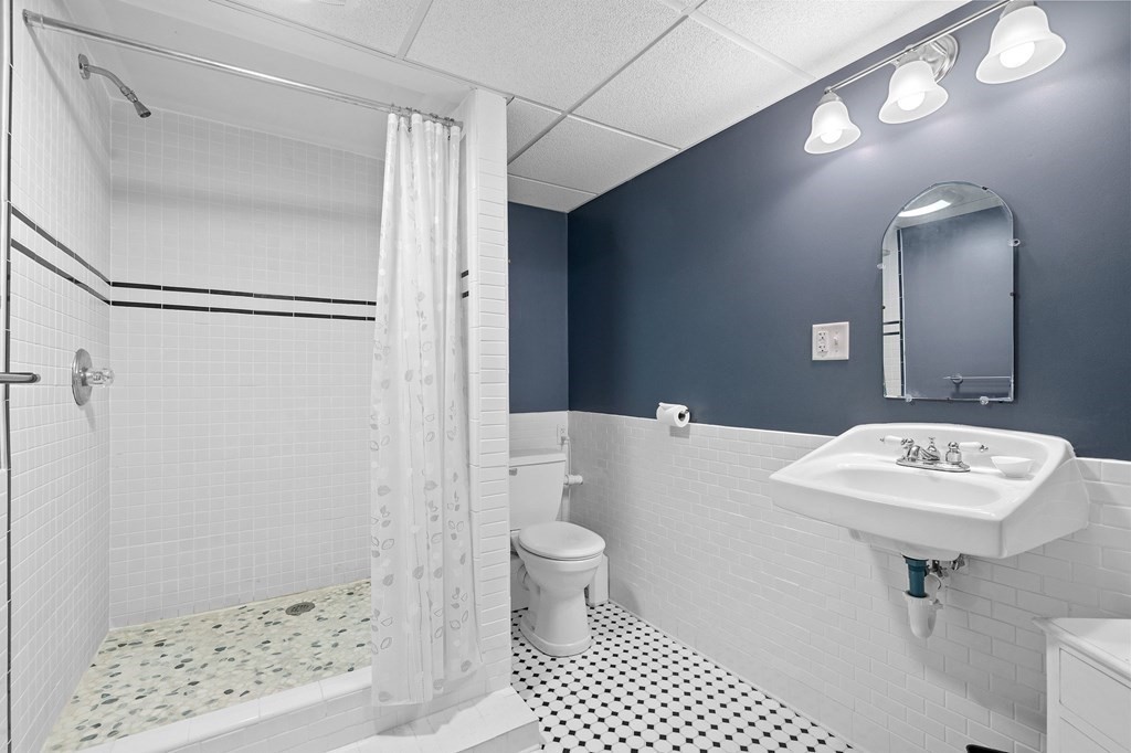 756 Bemis Road Warren, MA 01585 - Photo 10 of 41 a bathroom with a sink a toilet a shower and a mirror