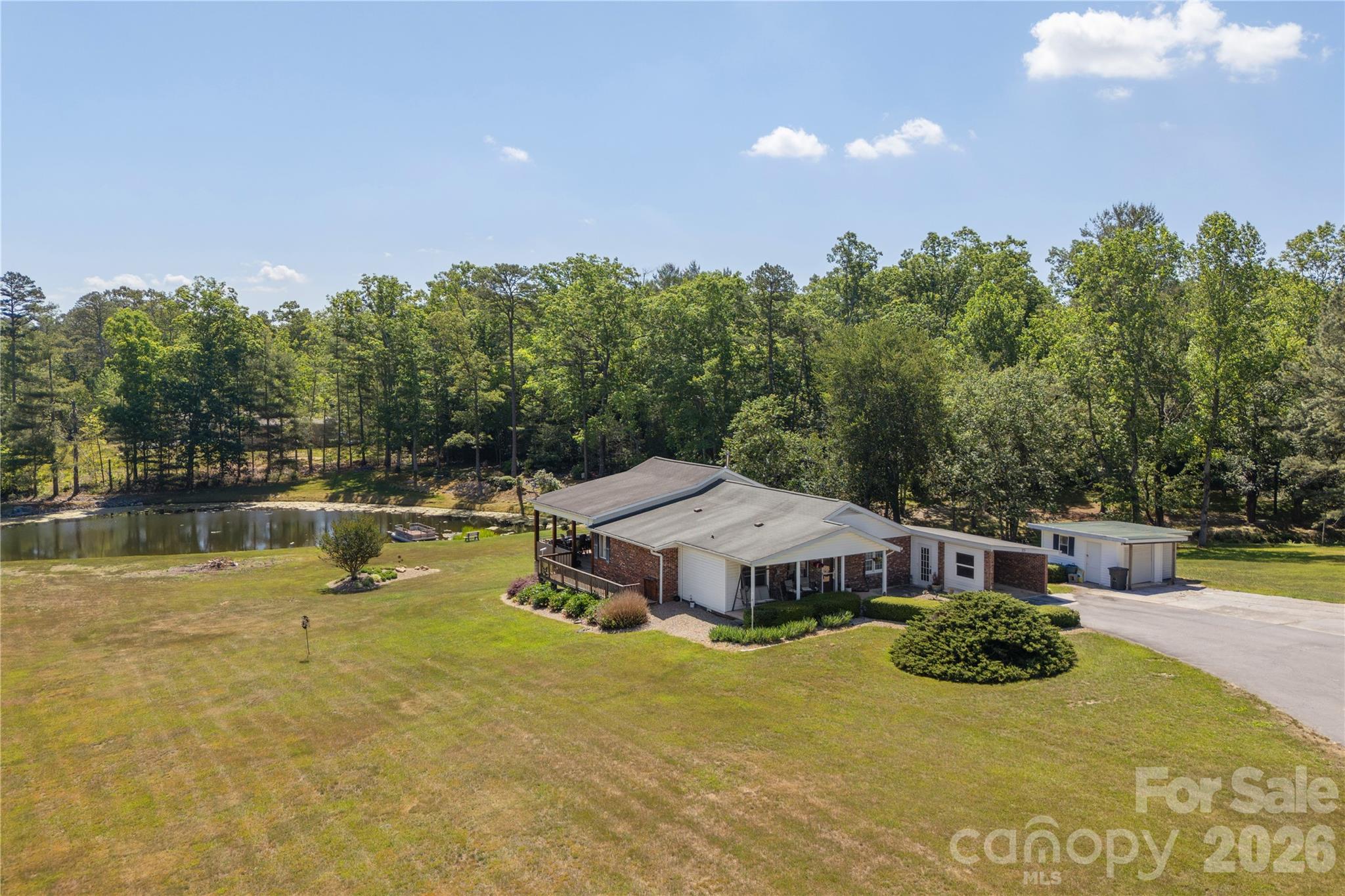 231 Allen Road East Flat Rock, NC 28726 - Photo 1 of 42 a view of a swimming pool with an outdoor space and seating area