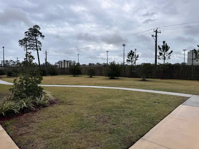 a kitchen with stainless steel appliances a sink a stove and microwave