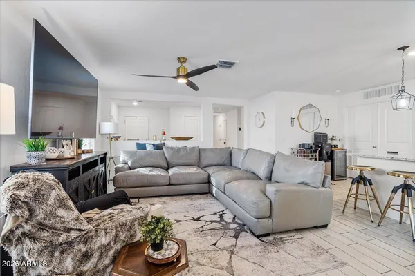 a view of a livingroom with furniture and window