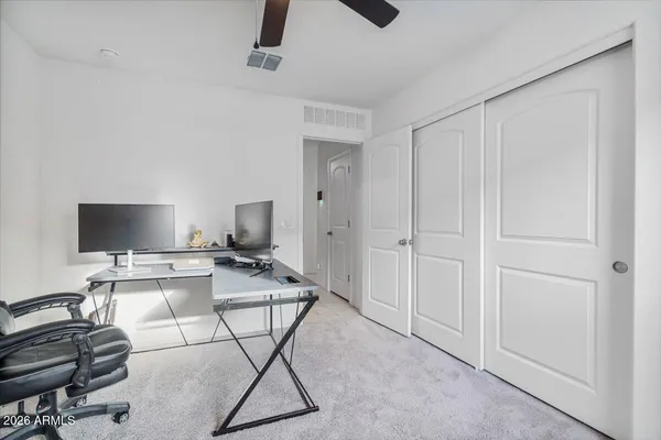 a bedroom with a bed and bathroom