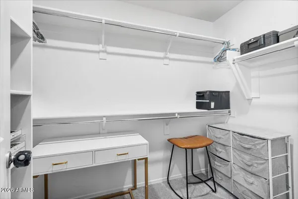 a bedroom with a bed and a tv