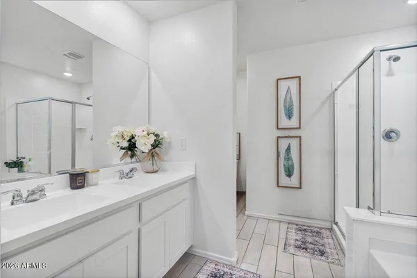 a bathroom with a bathtub and a shower
