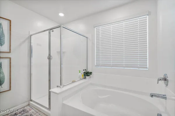 a white toilet sitting next to a shower curtain