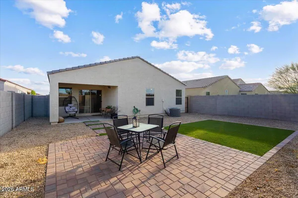 a view of a backyard and a patio