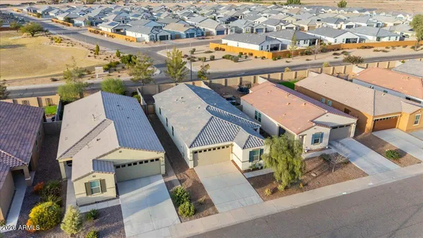 an aerial view of a house with a swimming pool