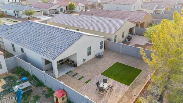 an aerial view of residential houses with outdoor space
