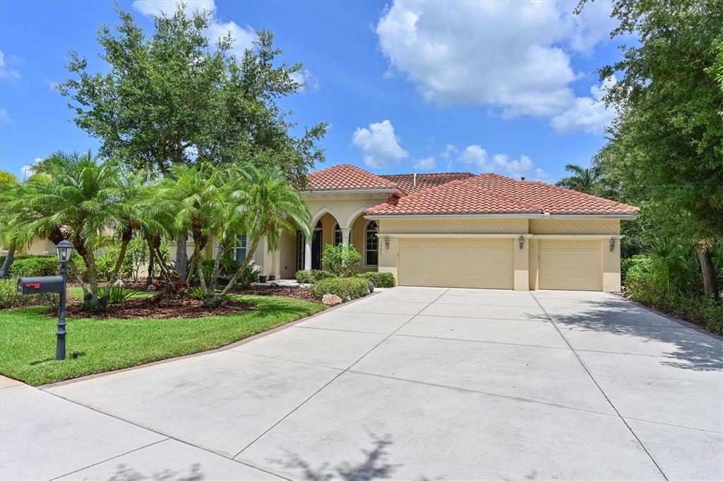 10622 Conch Shell Terrace Bradenton, FL 34212 - Photo 47 of 69 a front view of a house with yard and green space