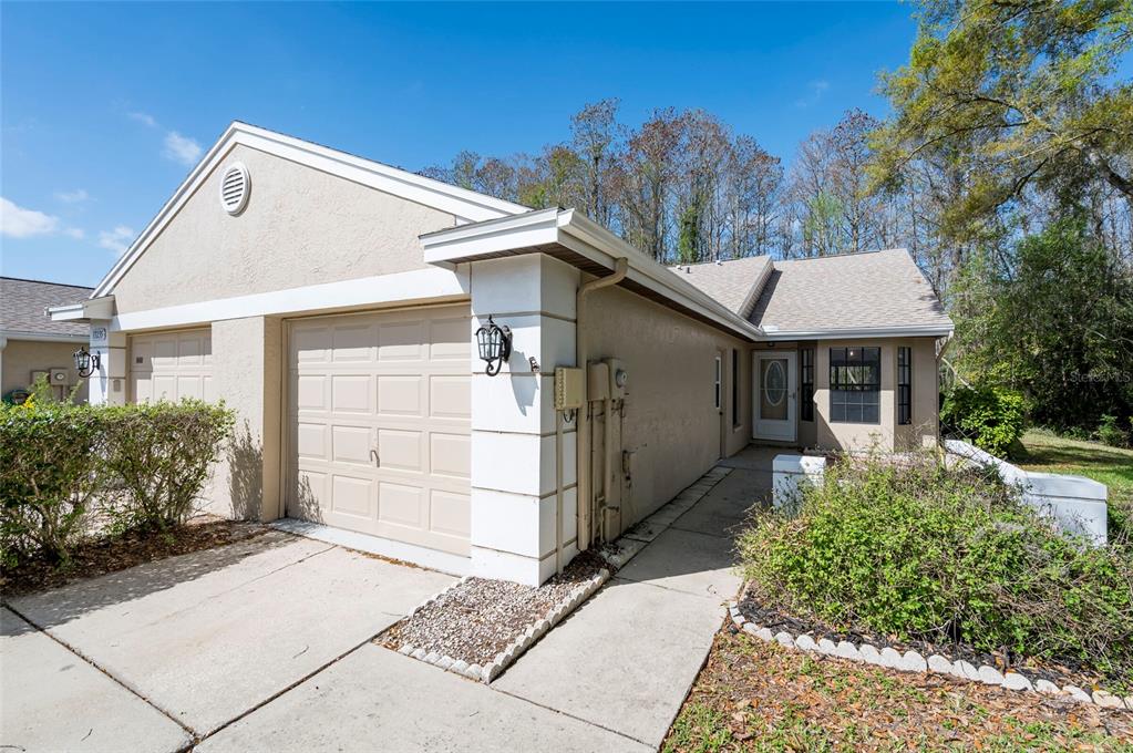 13237 Molitor Court, Unit 13237 Hudson, FL 34669 - Photo 1 of 1 a front view of a house with a yard