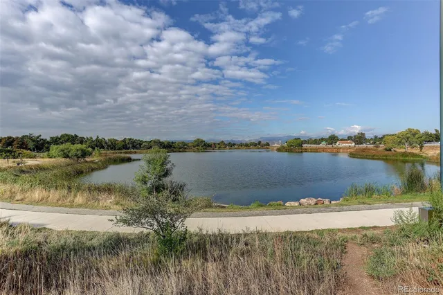 a view of a lake with houses in the back