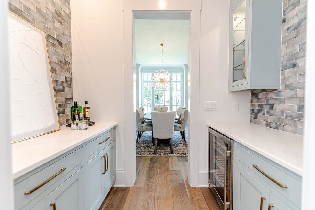 1008 Welch Lane Raleigh, NC 27614 - Photo 11 of 46 a kitchen with a sink dishwasher stove and wooden cabinets