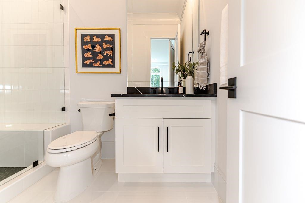 1008 Welch Lane Raleigh, NC 27614 - Photo 25 of 46 a bathroom with a sink toilet and mirror