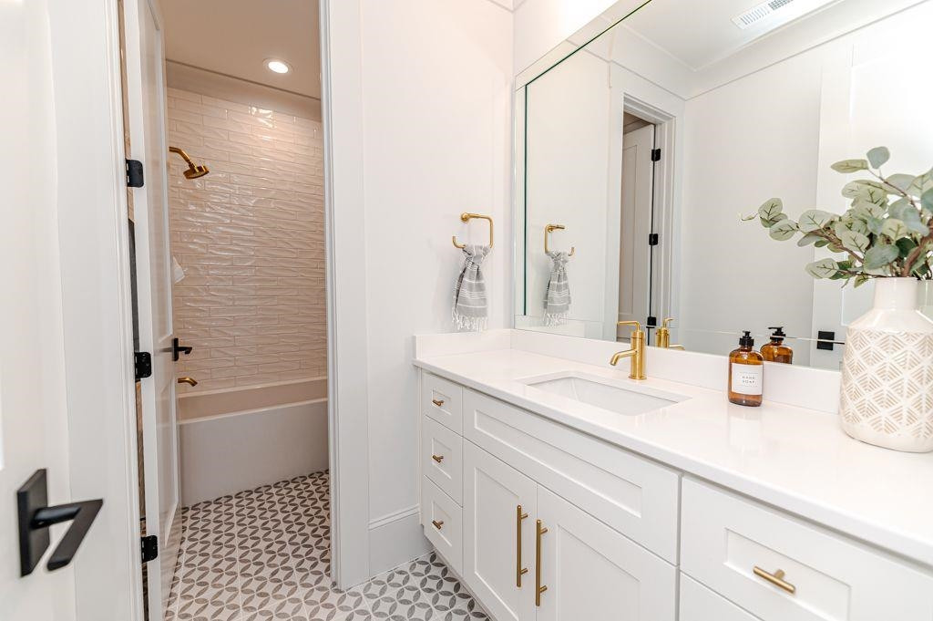 1008 Welch Lane Raleigh, NC 27614 - Photo 33 of 46 a bathroom with a sink and a mirror