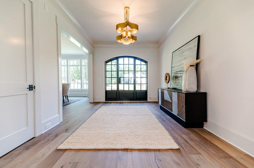 1008 Welch Lane Raleigh, NC 27614 - Photo 4 of 46 an empty room with wooden floor and windows