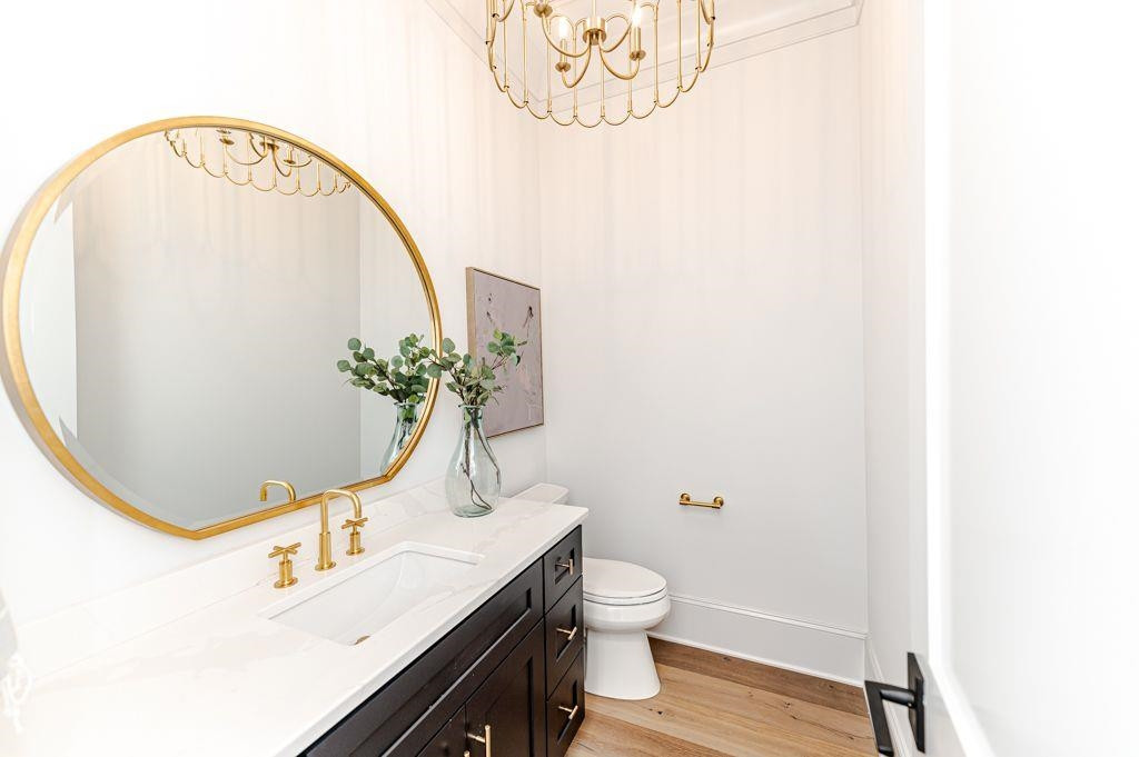 1008 Welch Lane Raleigh, NC 27614 - Photo 43 of 46 a bathroom with a sink mirror vanity and toilet