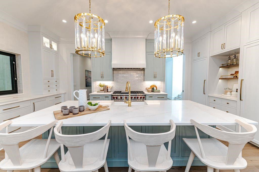 1008 Welch Lane Raleigh, NC 27614 - Photo 7 of 46 a dining room with wooden floor a chandelier a glass table and chairs