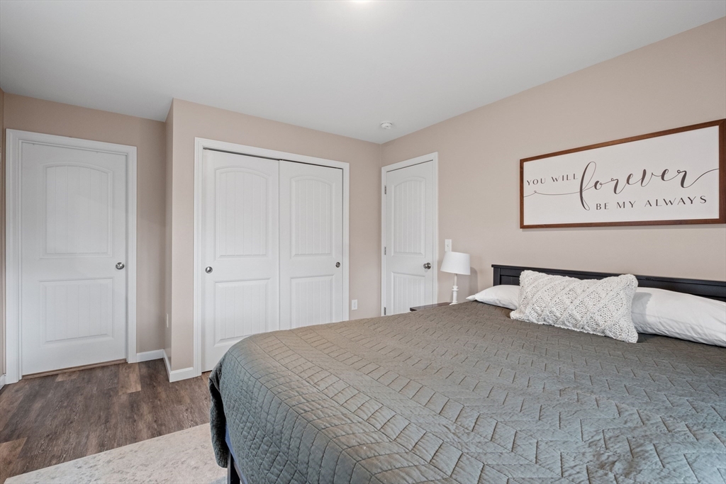 3 Fieldstone Drive Deerfield, NH 03037 - Photo 18 of 28 a bedroom with a bed and painting on the wall