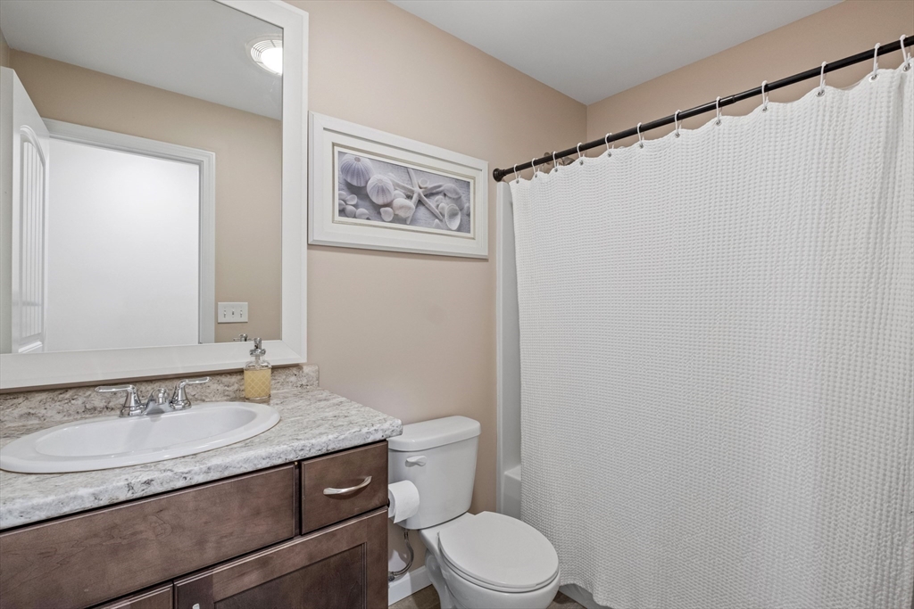 3 Fieldstone Drive Deerfield, NH 03037 - Photo 20 of 28 a bathroom with a granite countertop sink toilet and a mirror