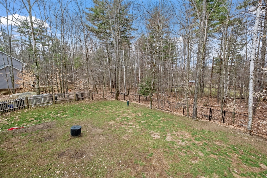 3 Fieldstone Drive Deerfield, NH 03037 - Photo 23 of 28 a backyard of a house with lots of green space