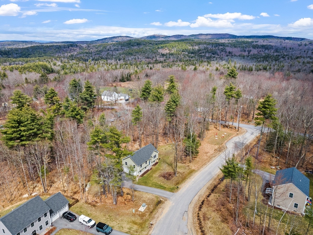 3 Fieldstone Drive Deerfield, NH 03037 - Photo 3 of 28 a view of a lake in middle of the town