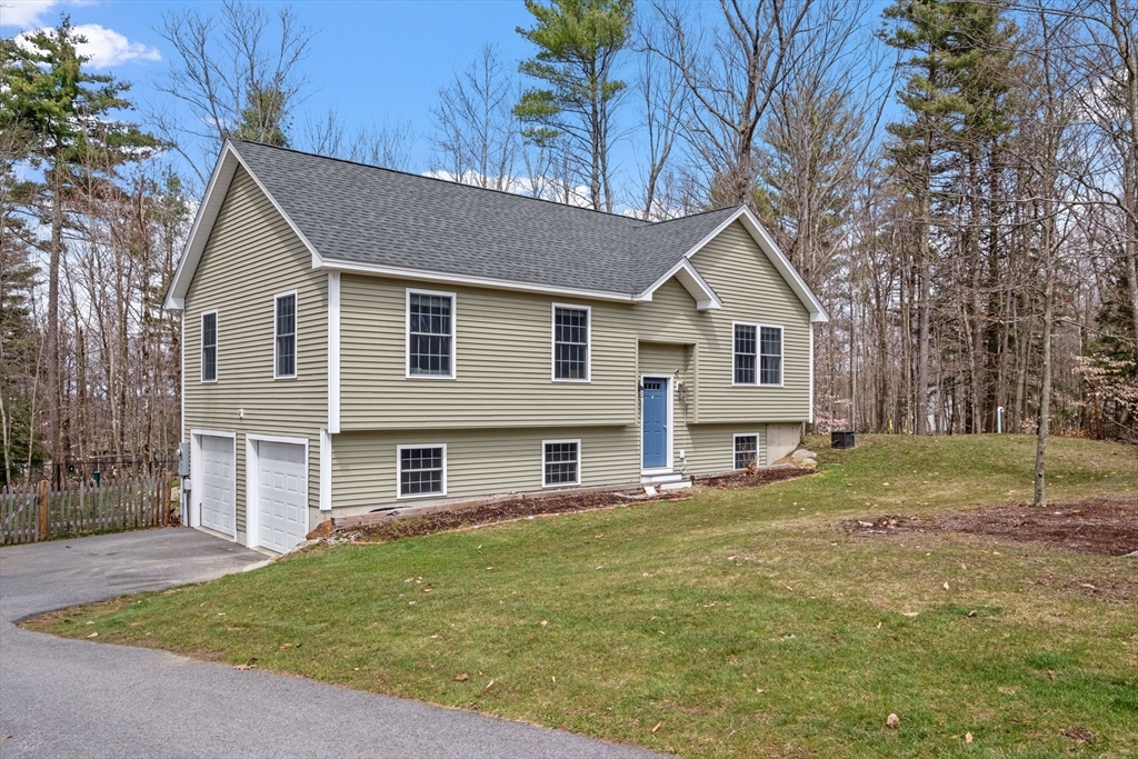 3 Fieldstone Drive Deerfield, NH 03037 - Photo 5 of 28 a front view of a house with a yard