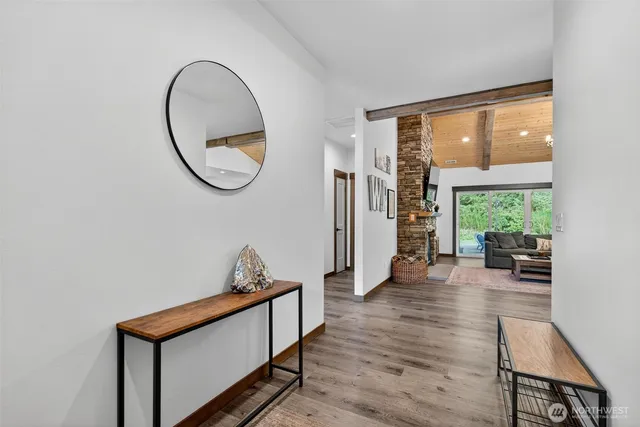 a view of a room with furniture and a large window