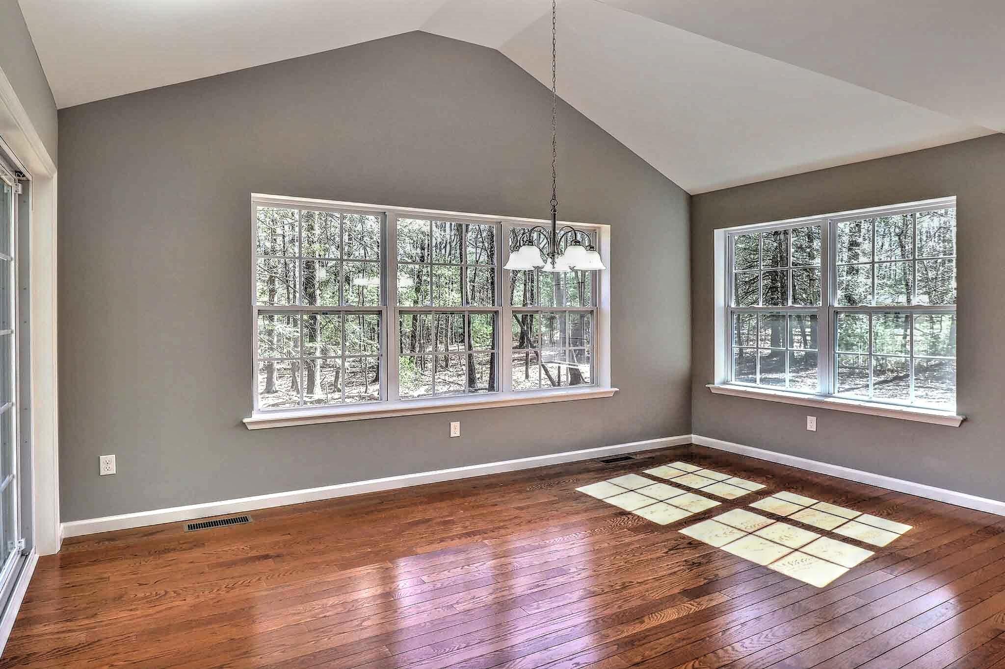 552 Long Mountain Road Effort, PA 18330 - Photo 12 of 47 a view of an empty room with wooden floor and a window