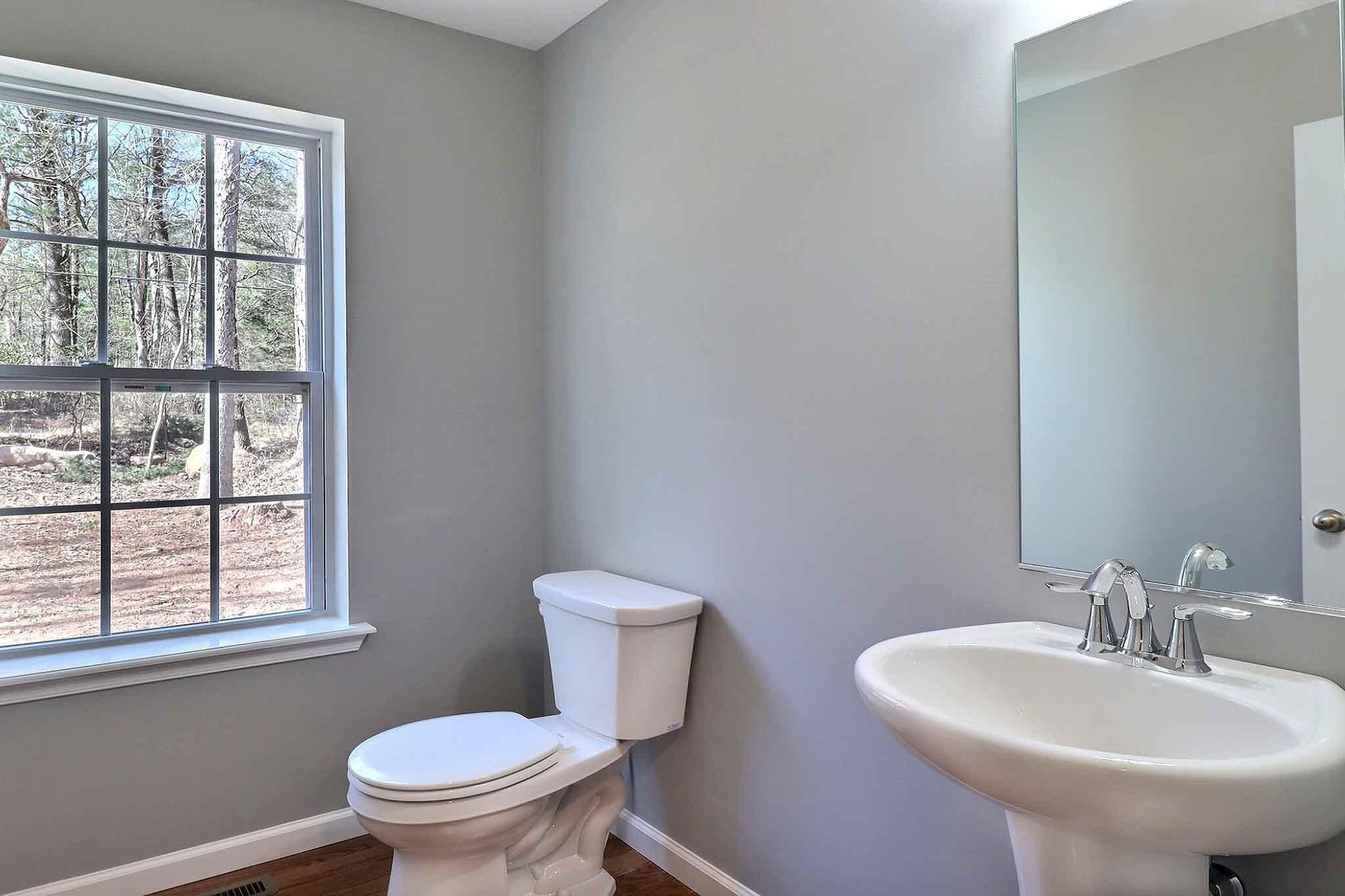 552 Long Mountain Road Effort, PA 18330 - Photo 21 of 47 a bathroom with a sink a toilet and a window