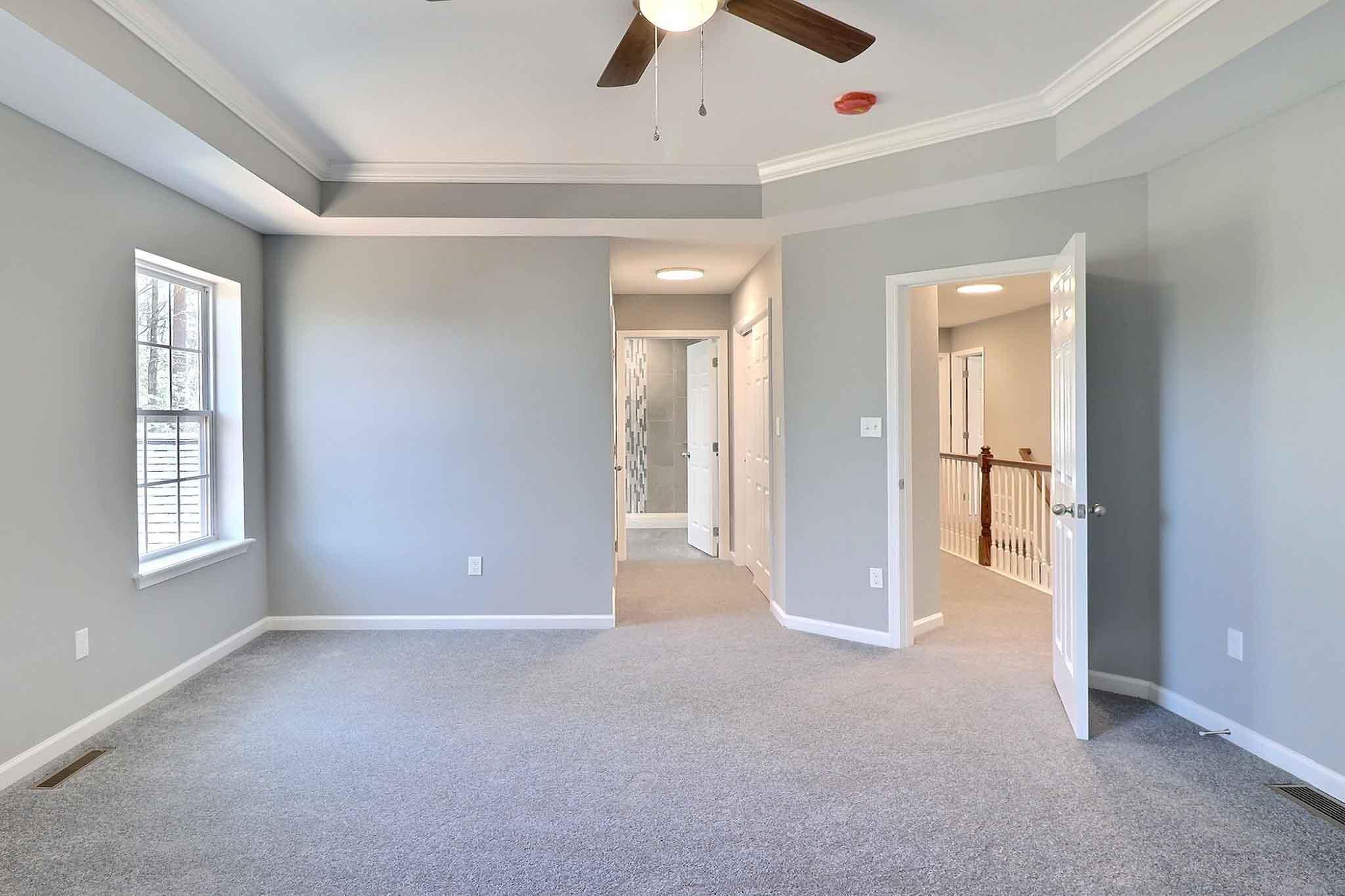 552 Long Mountain Road Effort, PA 18330 - Photo 24 of 47 an empty room with chandelier fan and windows