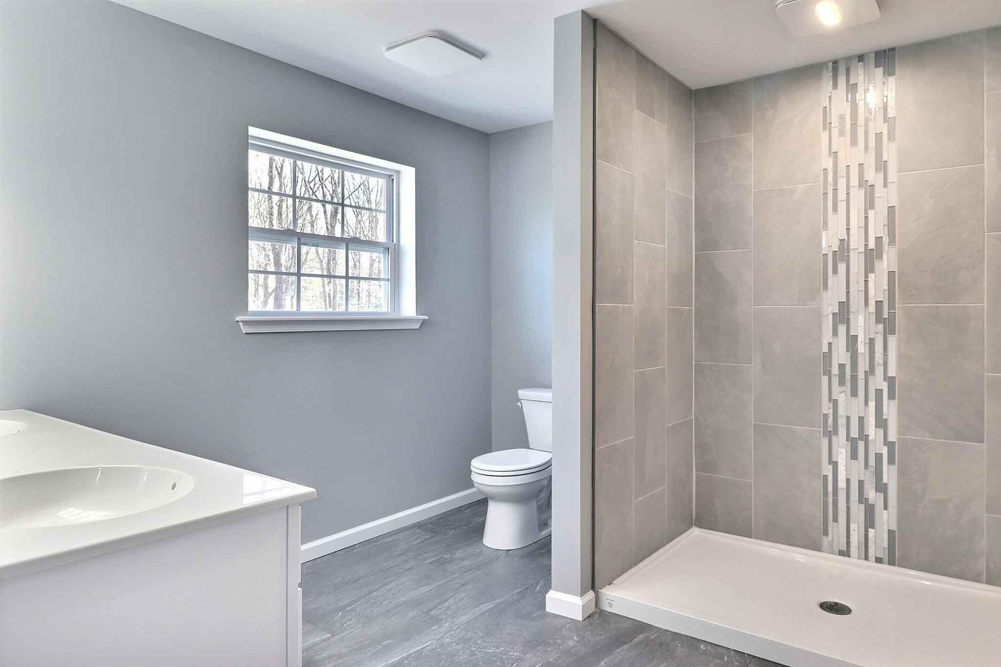 552 Long Mountain Road Effort, PA 18330 - Photo 27 of 47 a bathroom with a sink a toilet a shower and a window