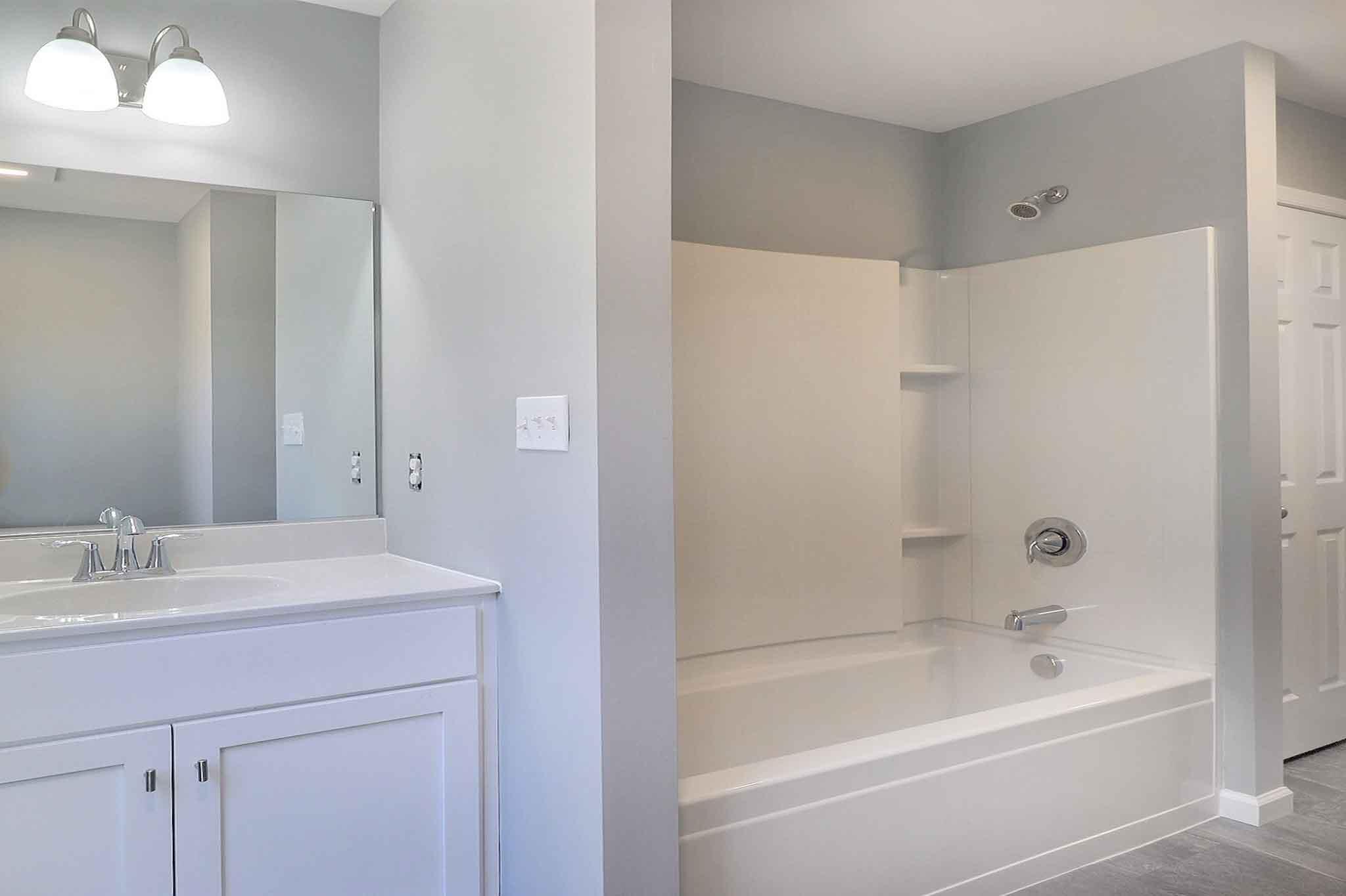 552 Long Mountain Road Effort, PA 18330 - Photo 31 of 47 a bathroom with a bathtub shower sink and vanity