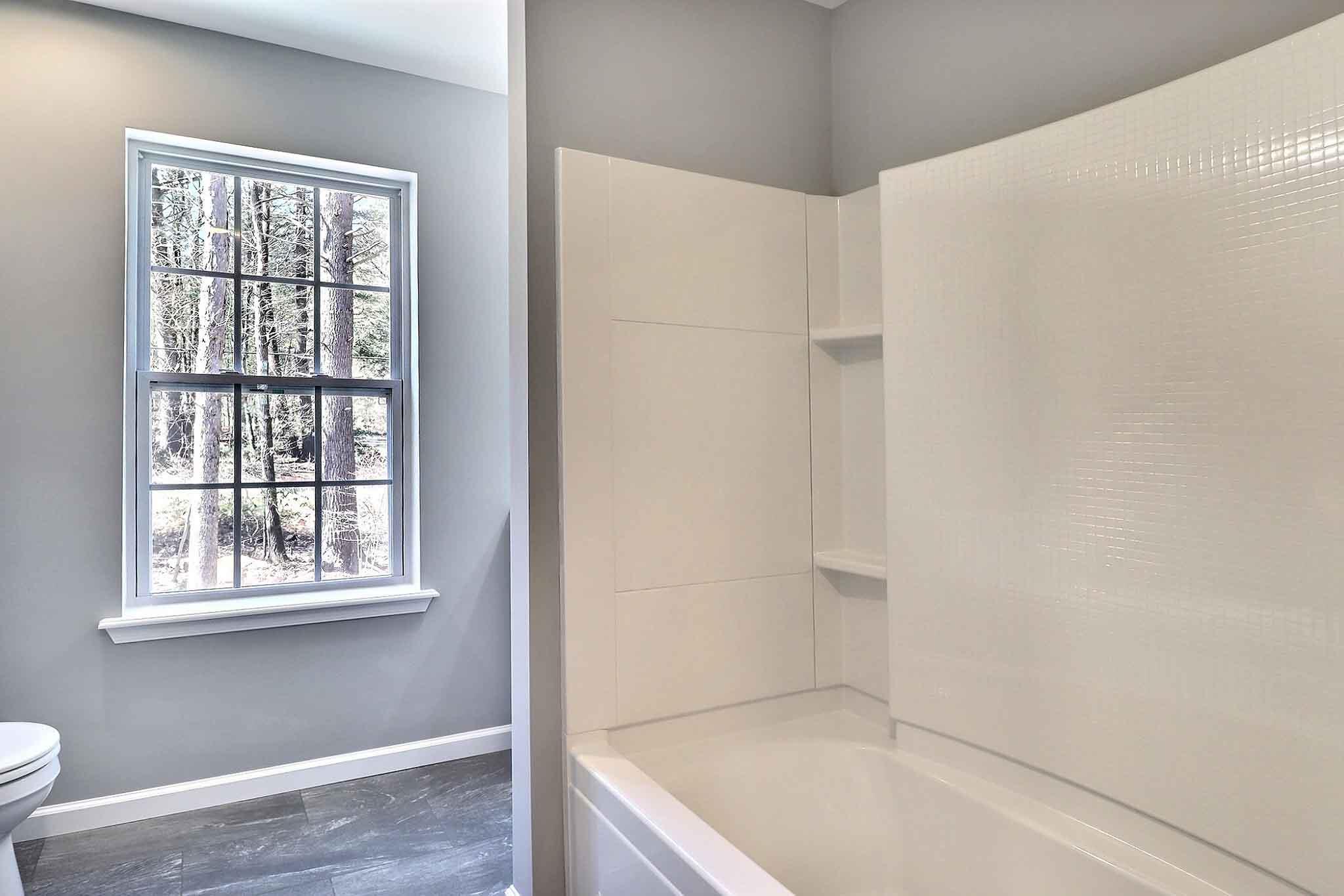 552 Long Mountain Road Effort, PA 18330 - Photo 32 of 47 a bathroom with a bathtub and a window