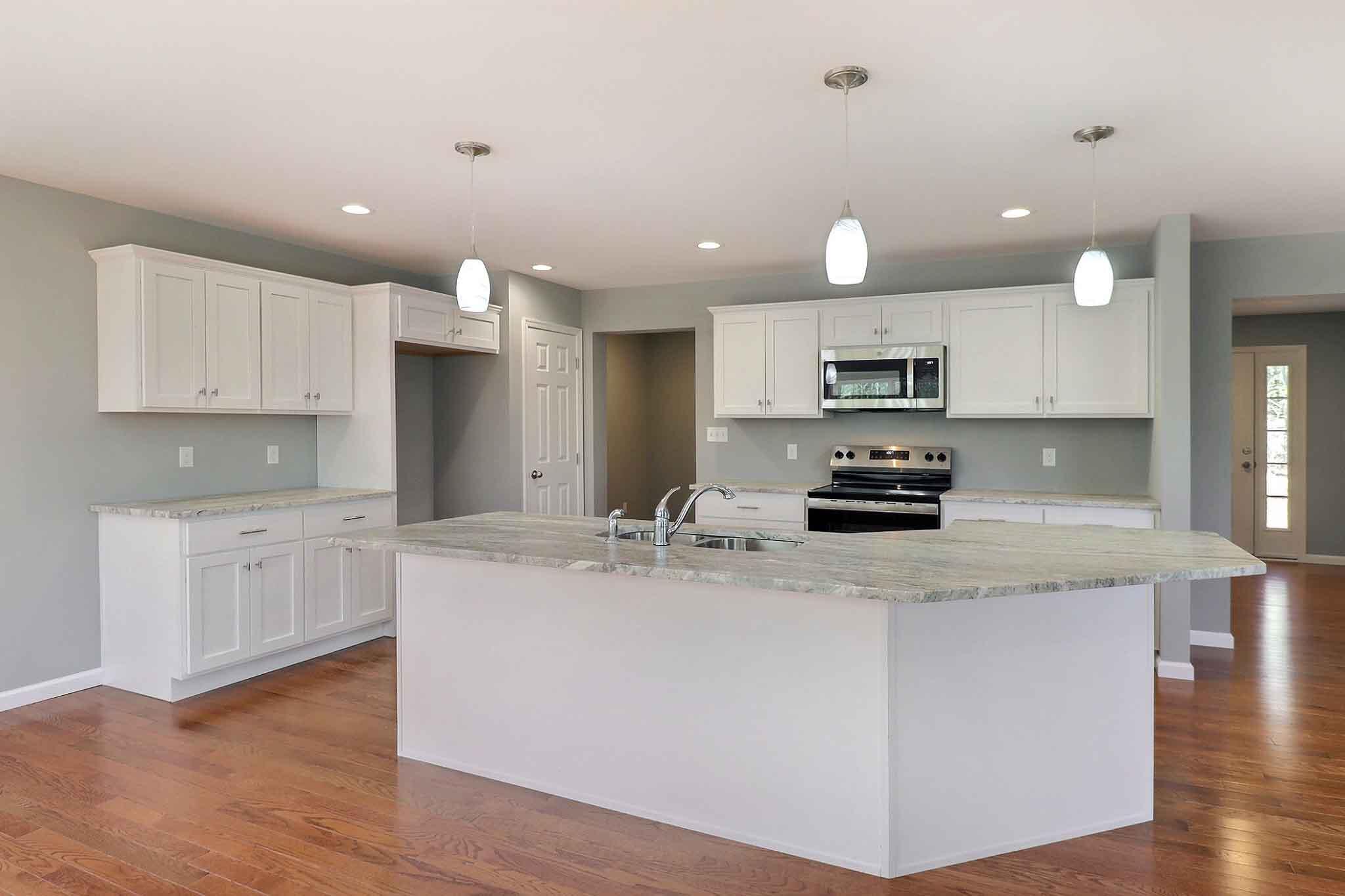 552 Long Mountain Road Effort, PA 18330 - Photo 7 of 47 a kitchen with a center island appliances and cabinets