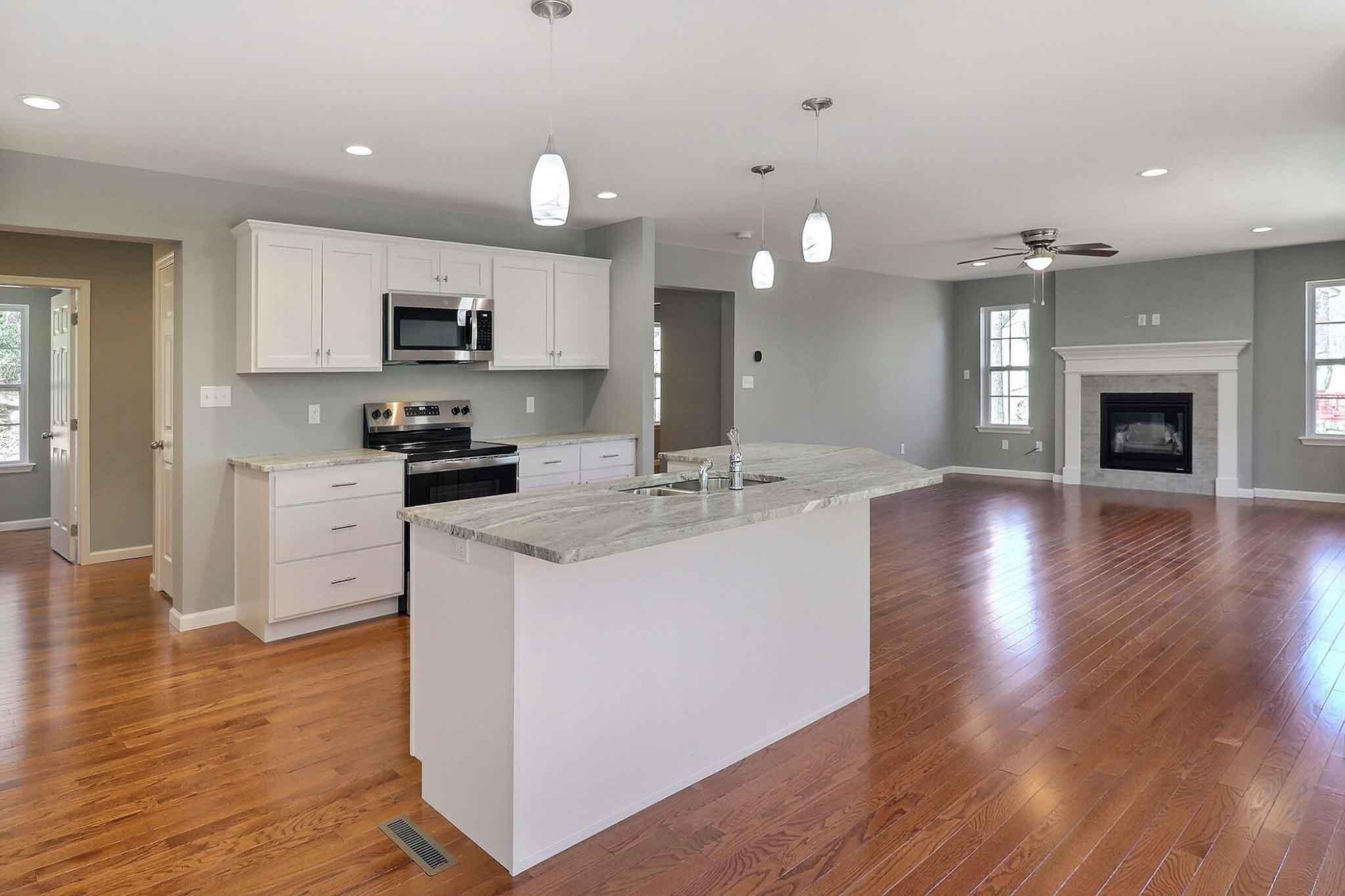 552 Long Mountain Road Effort, PA 18330 - Photo 8 of 47 a kitchen with a sink wooden floor stainless steel appliances and cabinets