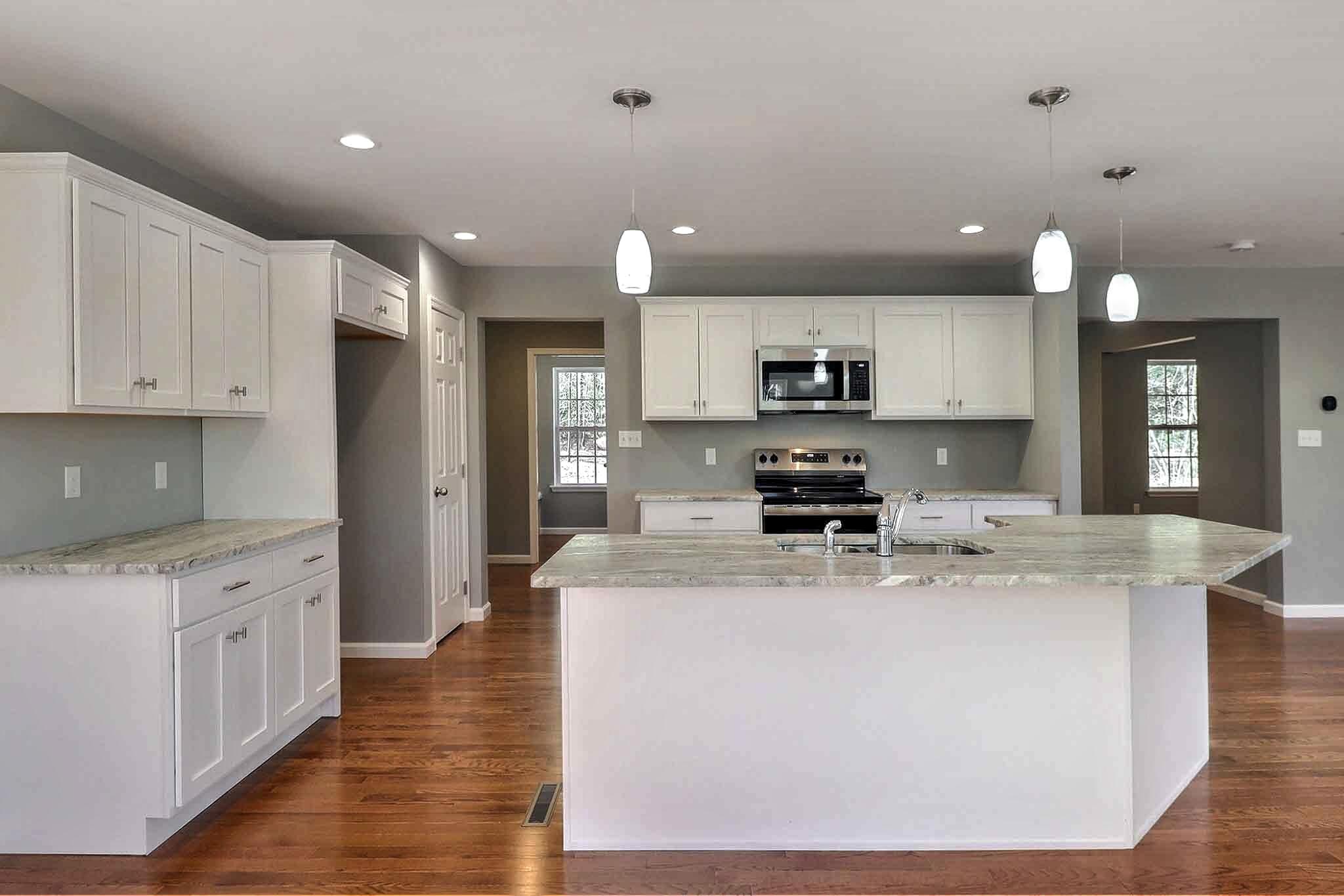 552 Long Mountain Road Effort, PA 18330 - Photo 9 of 47 a kitchen with stainless steel appliances granite countertop a sink stove and refrigerator